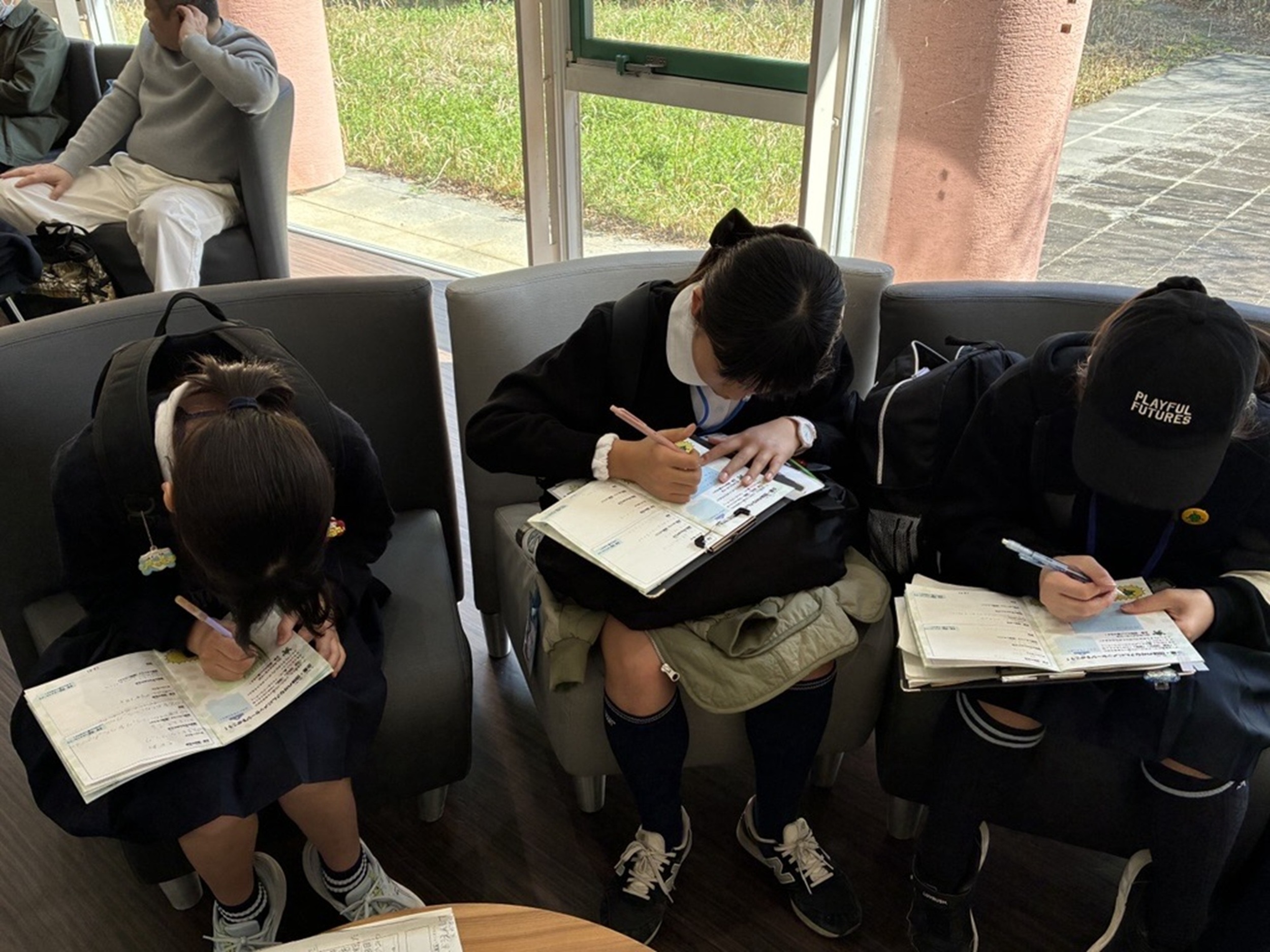 Children Using Field-Research Notebooks Produced with Panasonic's Support