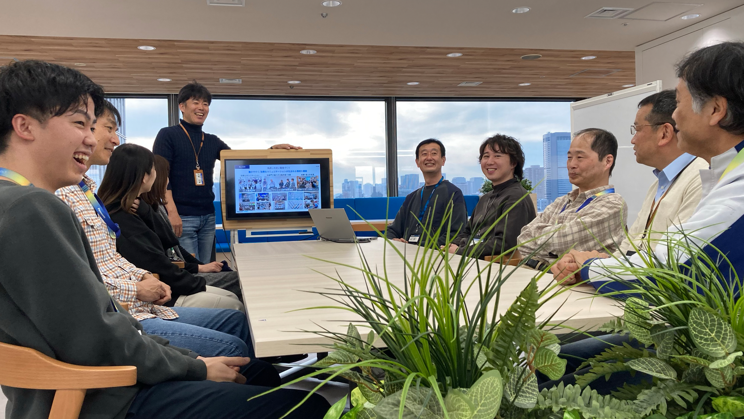 Photo: Smiling employees during a meeting