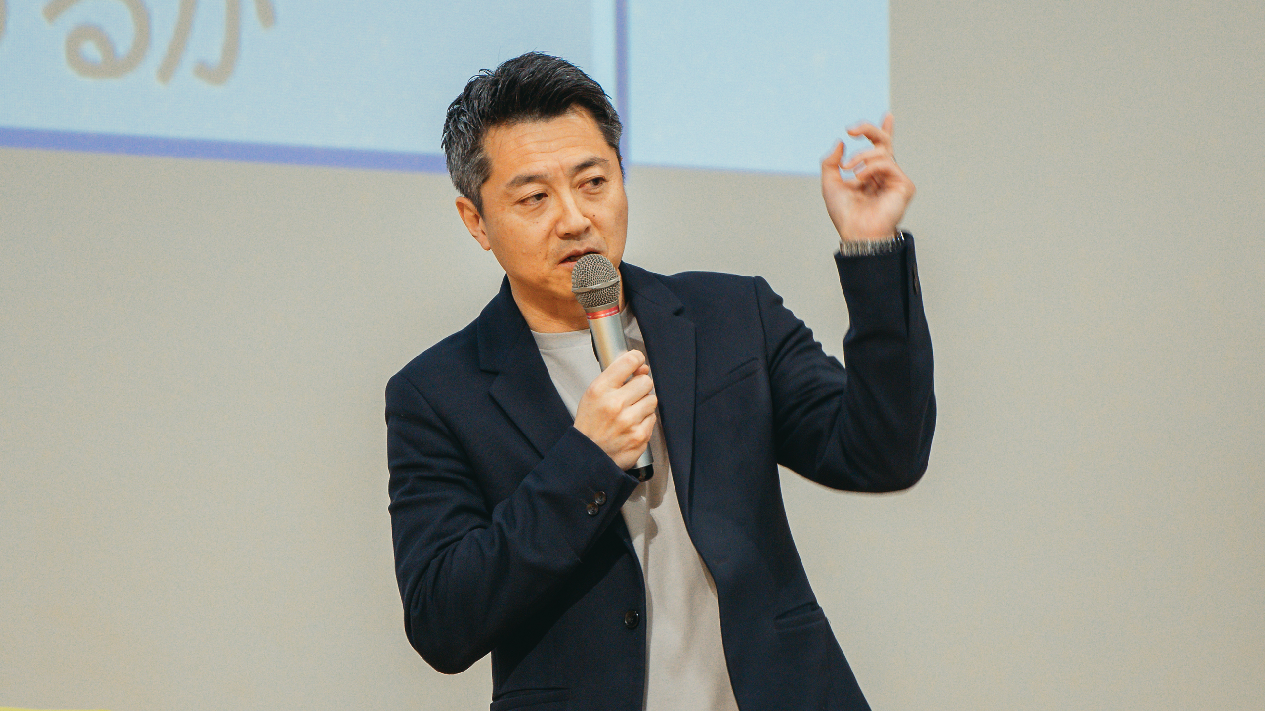 An executive is giving a presentation on the company policy.