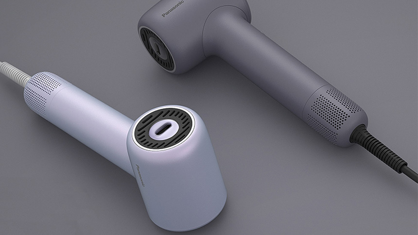 グレー面に置かれた白とグレーのヘアドライヤー2台、丸い吹出口と電源コード