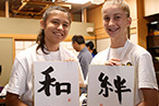 Photo: American girls showing their calligraphy works