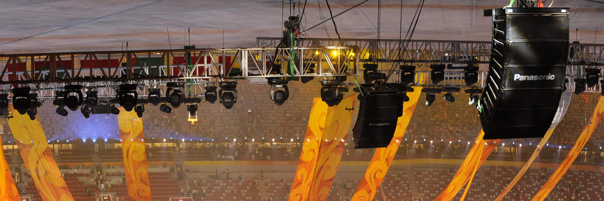 Photo: Professional RAMSA audio system equipment suspended from the ceiling of a venue of the Olympic Games Beijing 2008