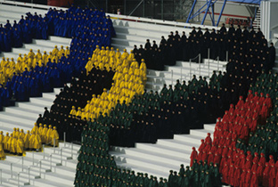 Photo: Performers gathered in the shape of the Olympic rings at the opening ceremony of the Olympic Winter Games Calgary 1988
