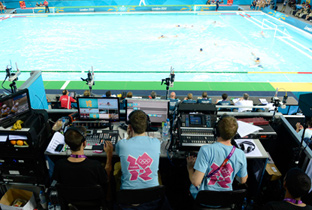 Photo: Staff working with broadcasting equipment at the water polo venue of the Olympic Games London 2012