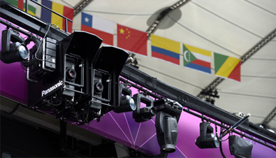 Photo: Compact DLP projectors installed alongside lighting equipment at a venue of the Olympic Games London 2012
