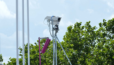 Photo: Box-type security camera enclosed in a housing installed outdoors