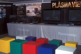 Photo: Editing equipment and monitors on display at the Panasonic broadcasting equipment exhibition booth