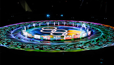 Photo of the PyeongChang 2018 Winter Games Closing Ceremony where laser projectors and projection mapping were used to create bright, colorful light