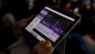 Photo: Operating a special application of a the multi-video streaming system by using a tablet