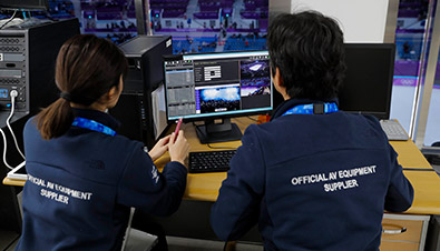 Photo of staff editing video for the multi-video streaming system