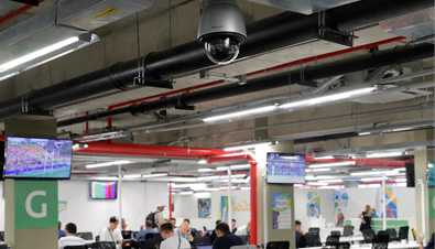 Photo: Outdoor security camera with housing installed on the ceiling of a facility