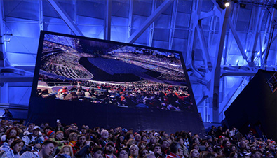 Photo: Spectators being shown on a large display unit installed at a venue of the Olympic Winter Games Sochi 2014