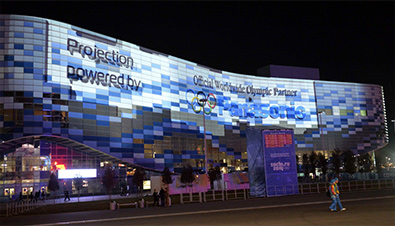 Photo: The Olympic rings and Panasonic logo projected on the facade of the Iceberg Skating Palace using DLP projectors at the Sochi Olympic Park
