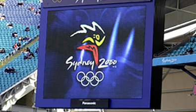 Photo: The Olympic Games Sydney 2000 emblem being shown on an ASTROVISION large display unit installed at a venue of the Olympic Games Sydney 2000