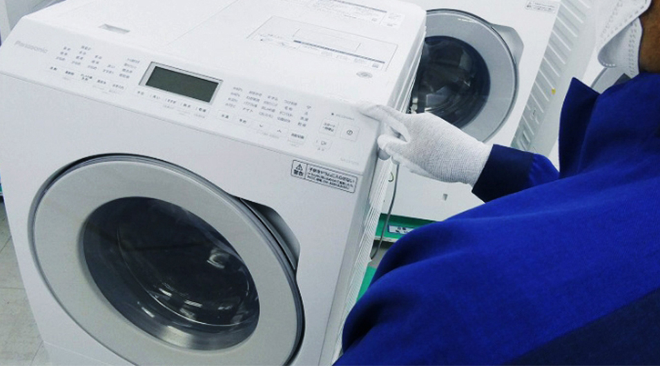 Photo of a washing machine during the refurbishment process.